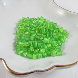 Miyuki 4mm square glass seed beads: Lime Green Lined Clear, SB2634, 20g (~208 beads)