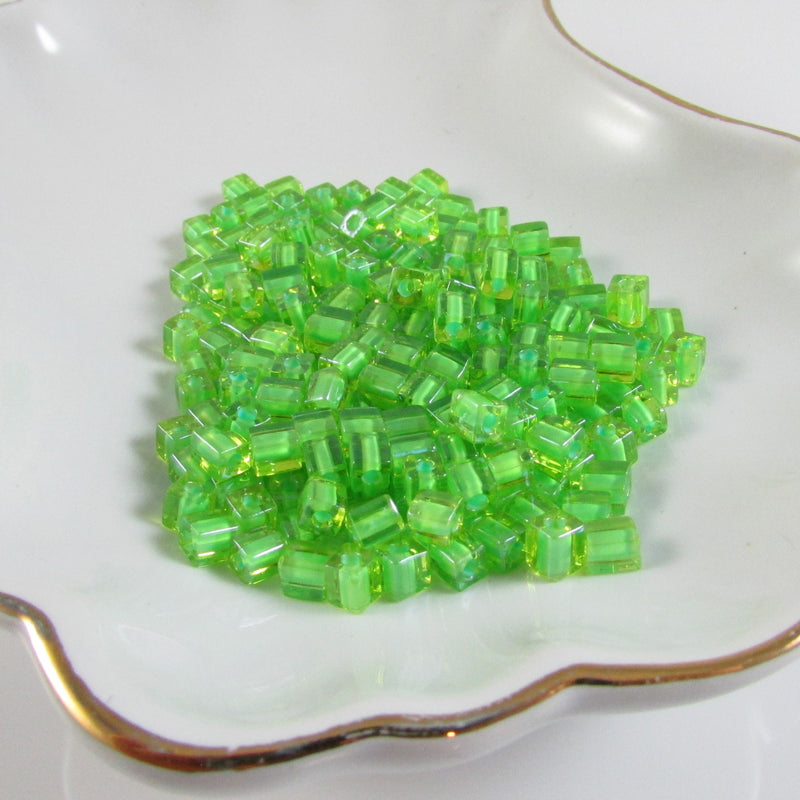 Miyuki 4mm square glass seed beads: Lime Green Lined Clear, SB2634, 20g (~208 beads)
