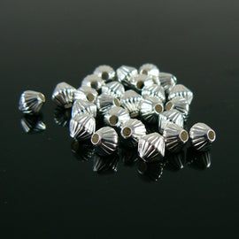 Metal beads: 5mm corrugated bicone, silver plated brass, 1.2mm hole, 25 beads