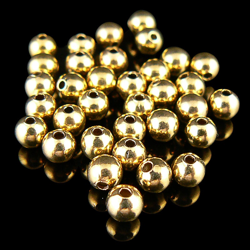 Metal beads: 4 mm smooth round, gold plated brass beads, 50 beads