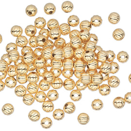 Metal beads: 4 mm corrugated round beads, gold plated brass, 50 beads
