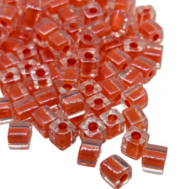 Miyuki 4mm square glass seed beads: clear color lined orange, SB236, 20g (~208 beads)