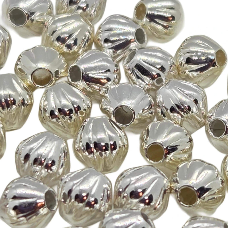 Metal beads: 4 mm corrugated bi-cone, silver plated brass, 1 mm bead hole, 50 beads