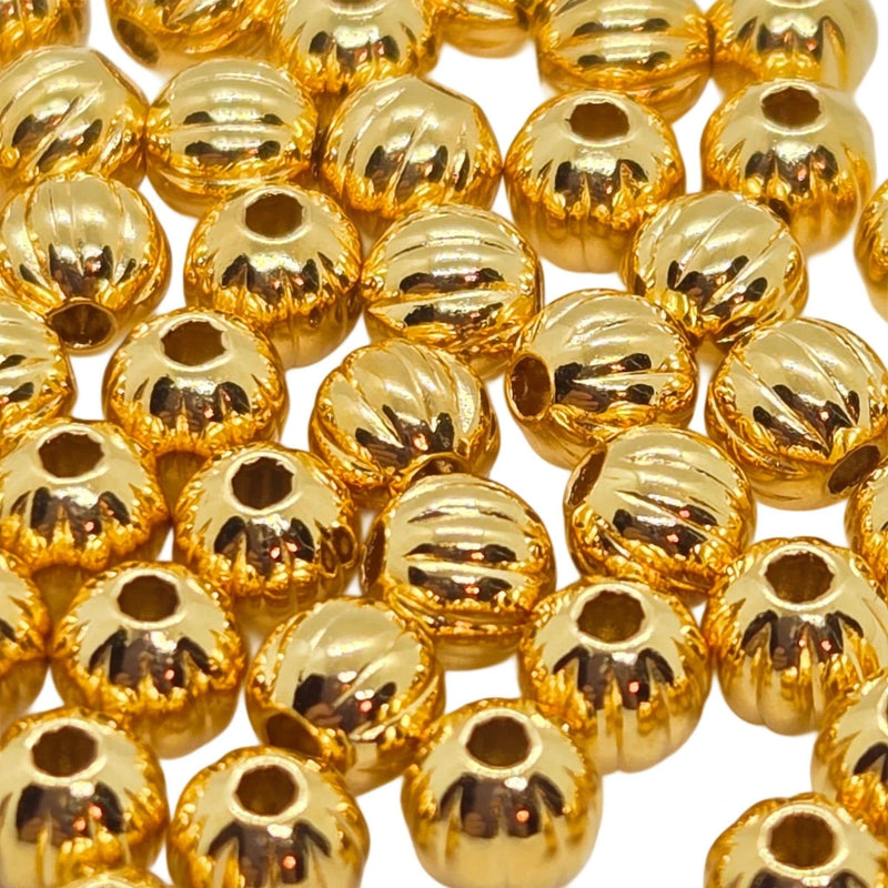 Metal beads: 4 mm corrugated round beads, gold plated brass, 50 beads