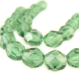 6mm faceted round transparent prairie green Czech fire polished glass beads, 6" strand (25 beads). St. Patrick's Day | Christmas | Spring